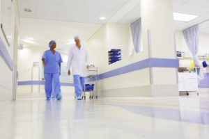 Doctors working in a busy hospital corridor